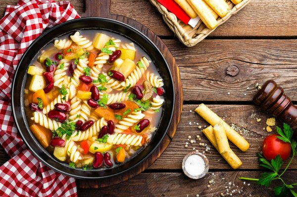 What Are the Secrets to a Rich Italian Minestrone with Seasonal Vegetables and Pesto?