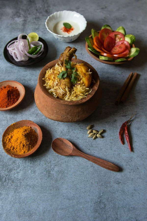 Can You Prepare a Gourmet Indian Biryani with Saffron-Infused Rice and Marinated Chicken?